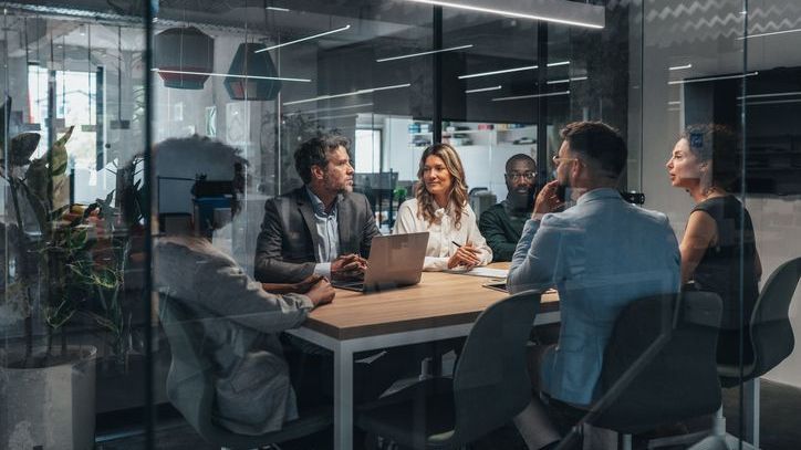 Project managers and team leaders collaborating in a TechConnex project management peer group